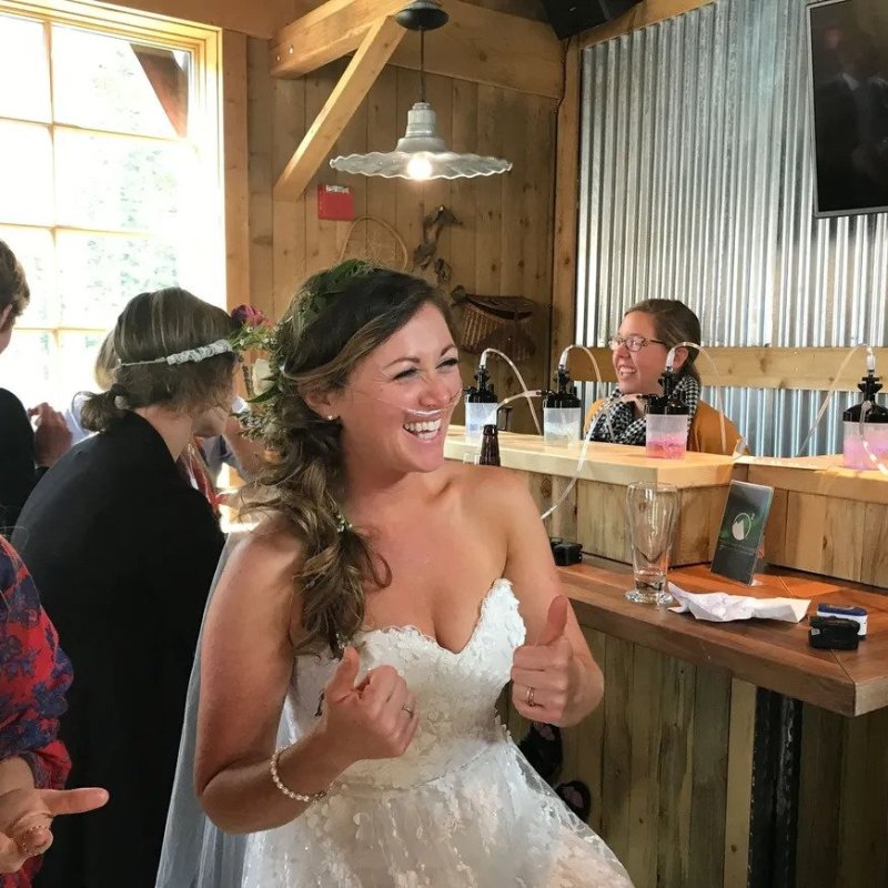 a couple of people that are standing in the kitchen