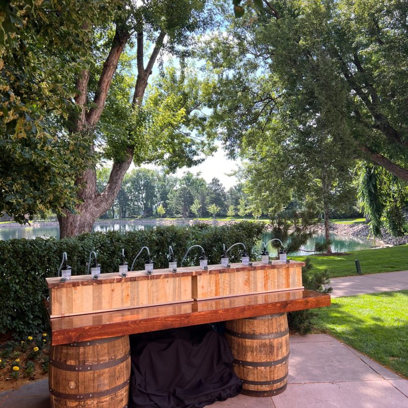 a wooden bench sitting next to a tree